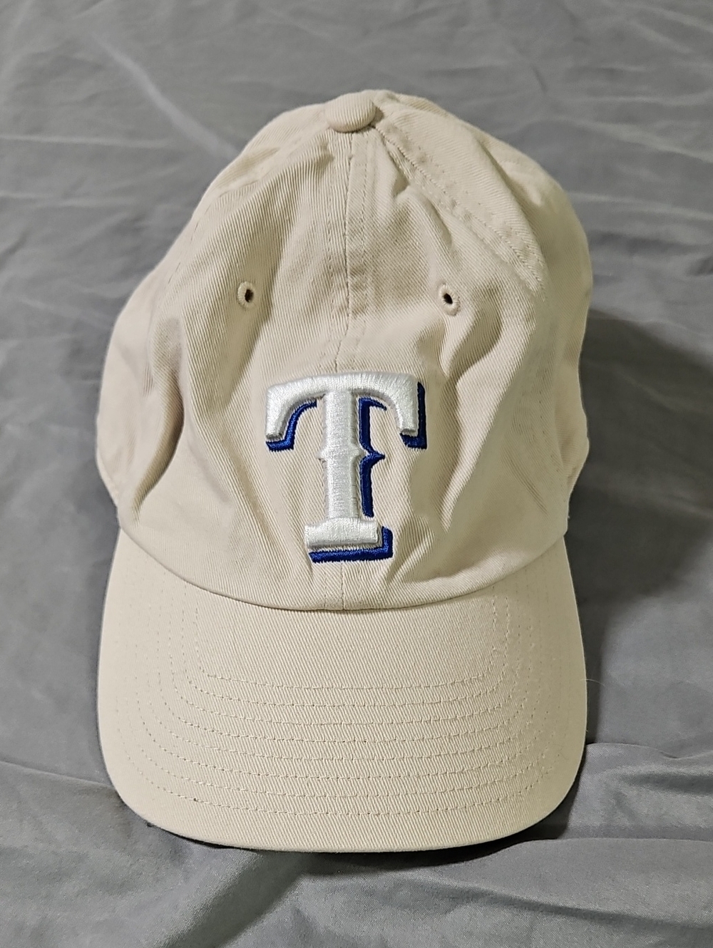 Genuine Merchandise Beige Baseball Cap with White and Blue 'T' Patch